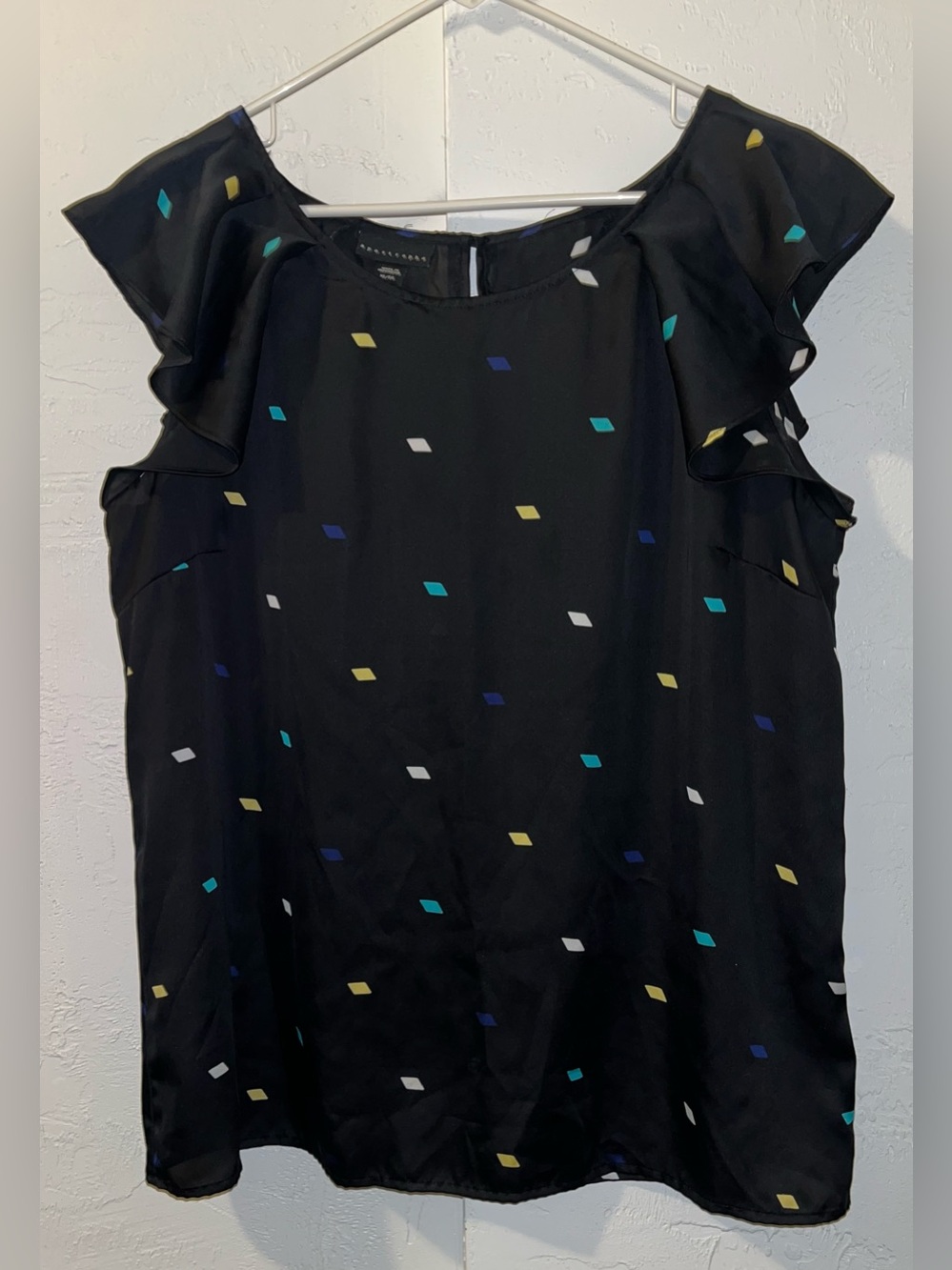 Apostrophe Black Blouse with Diamond Pattern in Teal, White, Yellow and Blue.